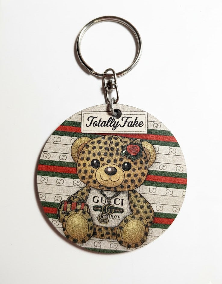 Portachiavi/Charm in legno "Totally Fake"