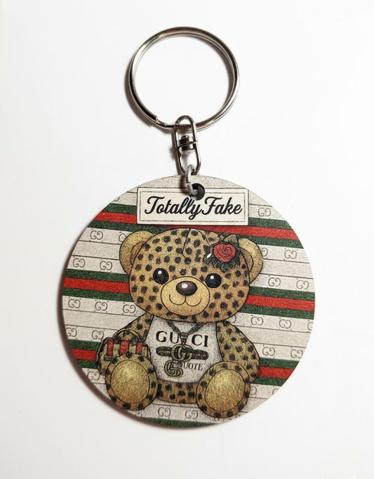 Portachiavi/Charm in legno "Totally Fake"